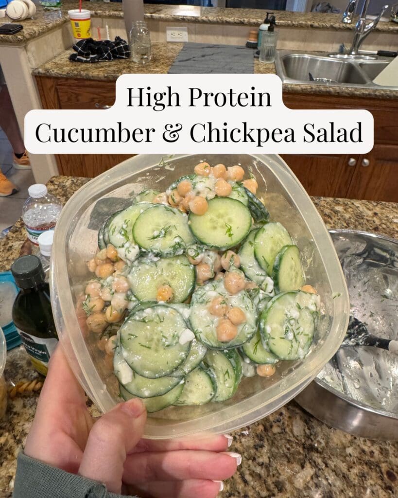 bowl of high protein cucumber chickpea salad with fresh dill and dairy free feta with text overlay that reads high protein cucumber chickpea salad that beats any sad desk salad