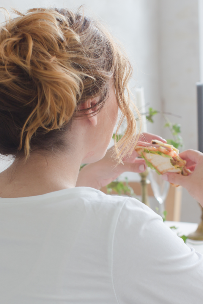Woman looking frustrated at a sad desk lunch